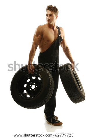 stock-photo-muscular-man-carrying-tires-62779723.jpg