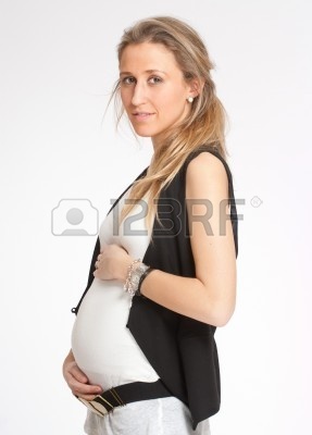 7258795-young-woman-four-months-pregnant-holding-her-belly.jpg