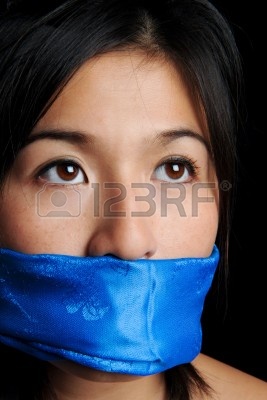 6571035-girl-gagged-with-blue-scarf-looks-for-freedom.jpg